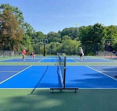 Players practicing dinks at the net